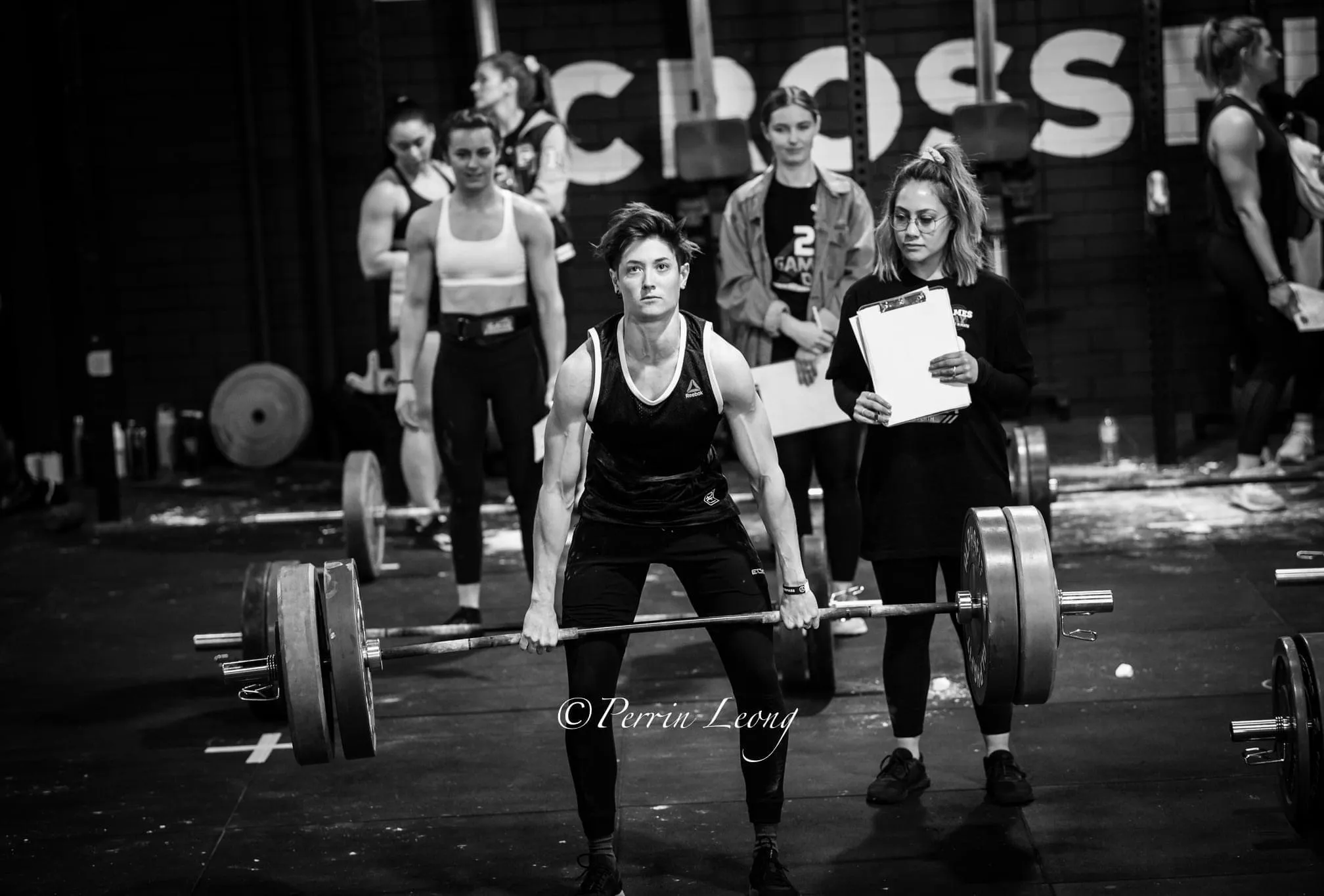 Offset athlete deadlifting during competition