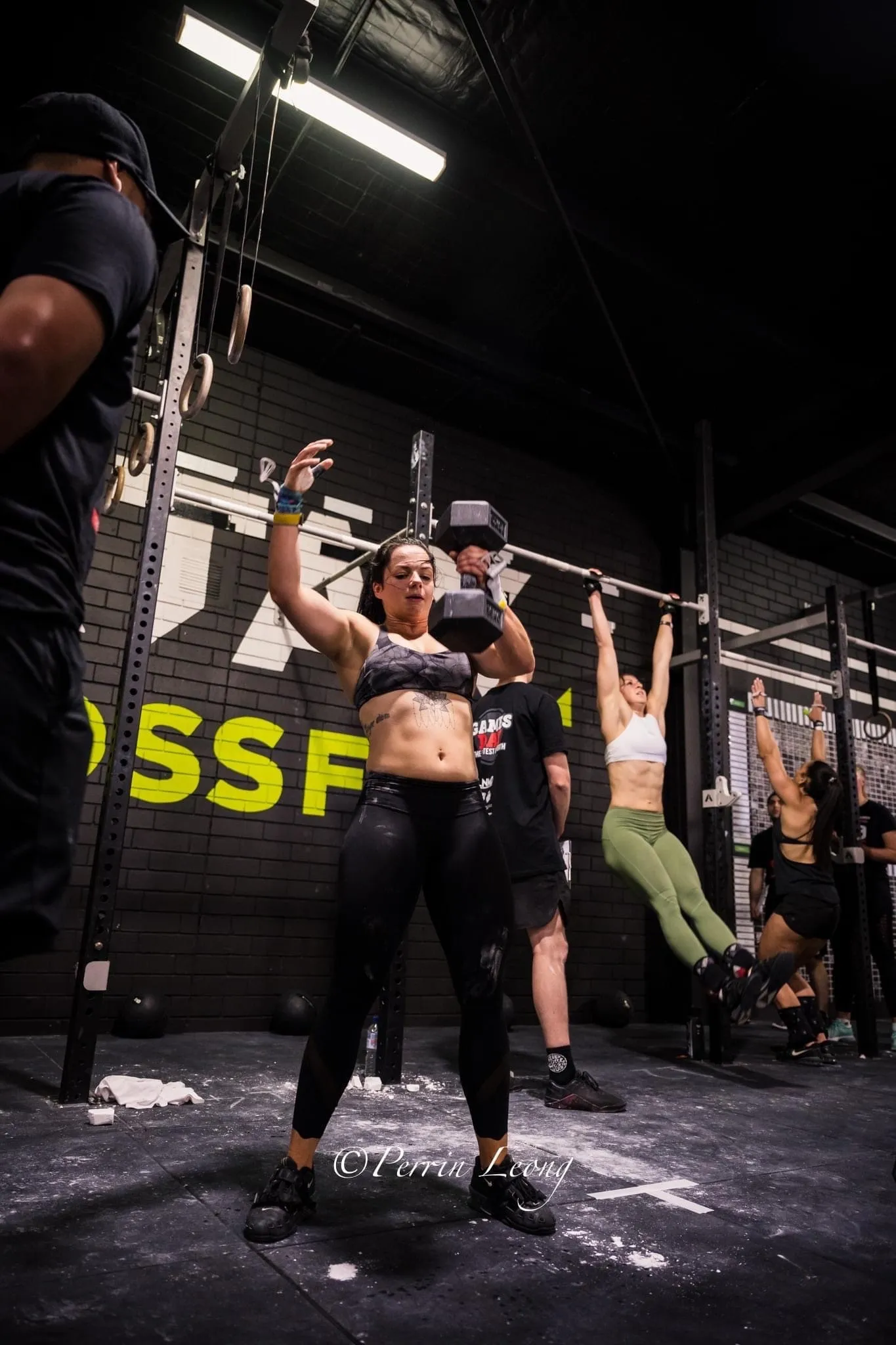 Offset athlete performing dumbell snatch